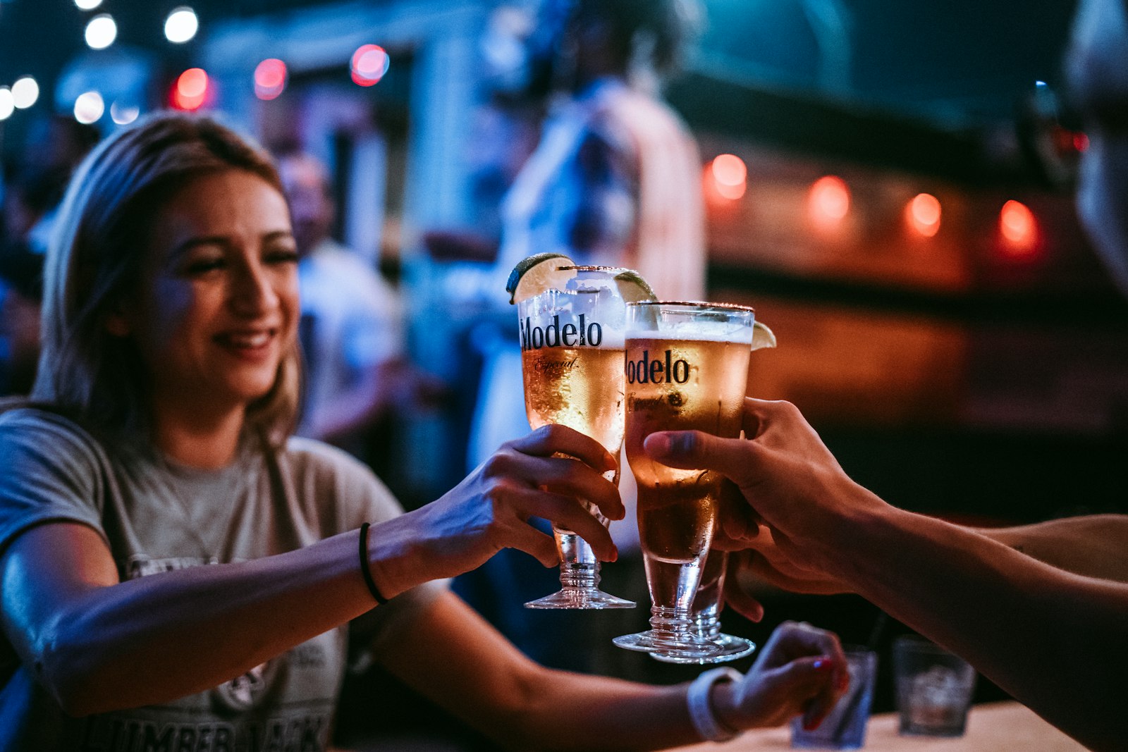 Group of friends toasting in a bar on the Valencia pub crawl